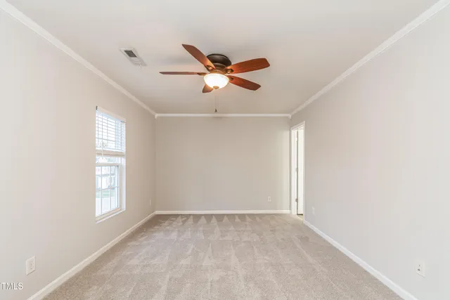 a view of a ceiling fan and window