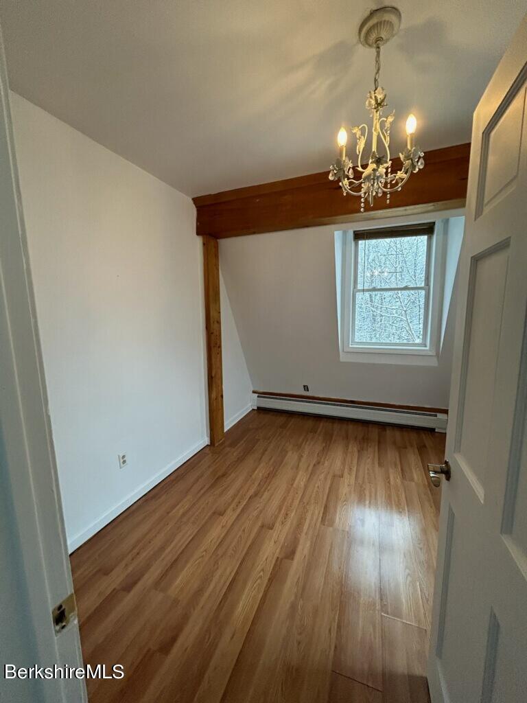 4 Olson Road Florida, MA 01247 - Photo 17 of 29 a view of a room with wooden floor and chandelier