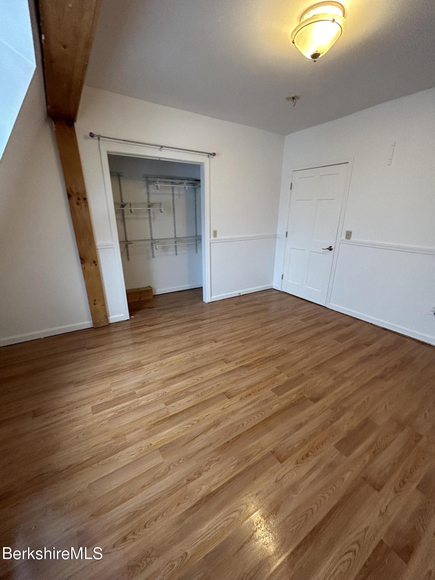 4 Olson Road Florida, MA 01247 - Photo 20 of 29 a view of an empty room with wooden floor and closet