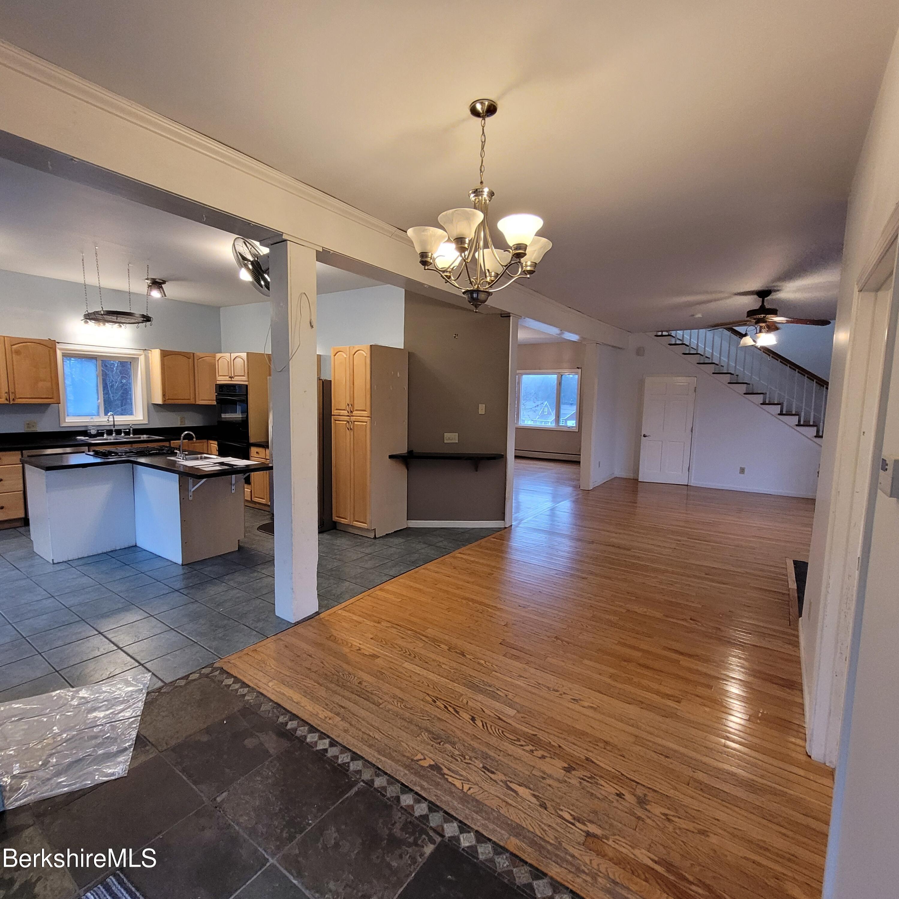 4 Olson Road Florida, MA 01247 - Photo 4 of 29 a view of a kitchen with granite countertop stainless steel appliances and wooden floor