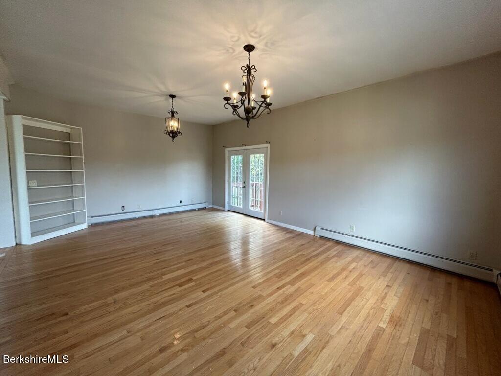 4 Olson Road Florida, MA 01247 - Photo 7 of 29 wooden floor in an empty room with a window