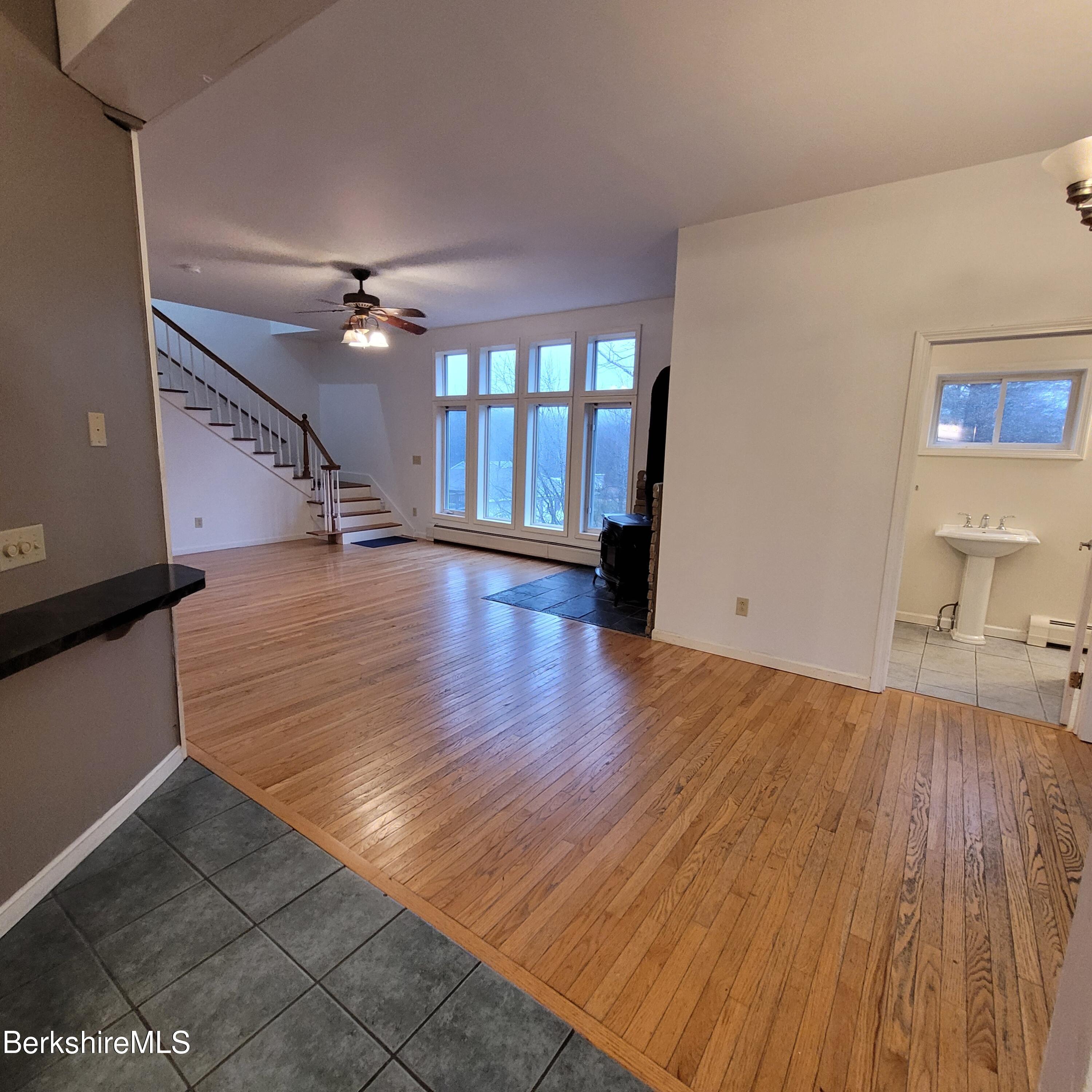 4 Olson Road Florida, MA 01247 - Photo 8 of 29 a view of an empty room with wooden floor and a window