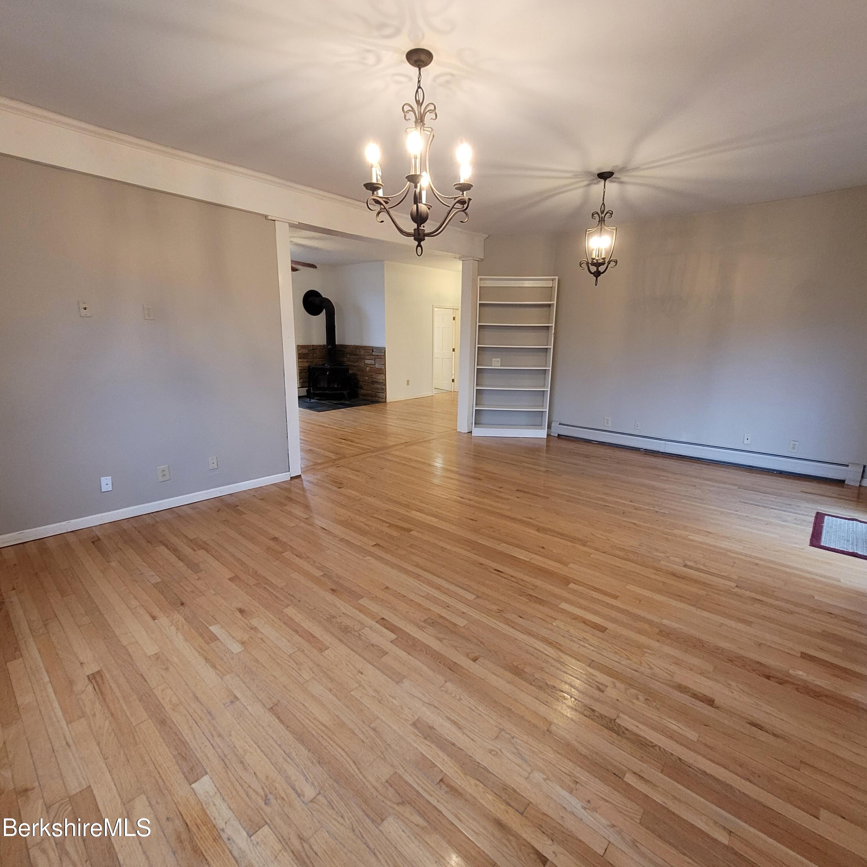 4 Olson Road Florida, MA 01247 - Photo 10 of 29 a view of a livingroom with a chandelier fan and wooden floor