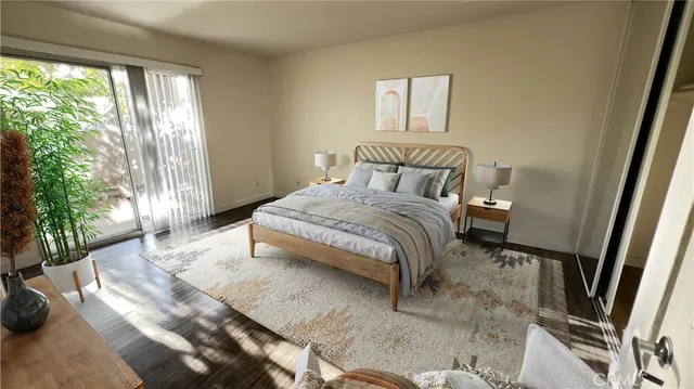 a bedroom with a bed and a large window