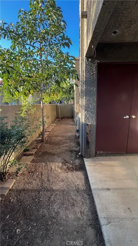a backyard of a house with large trees