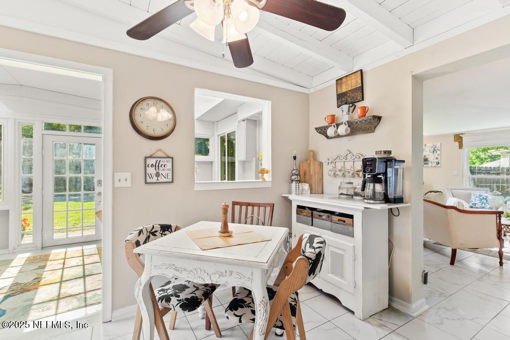 1810 Griflet Road Jacksonville, FL 32211 - Photo 14 of 42 a view of a dining room with furniture and chandelier