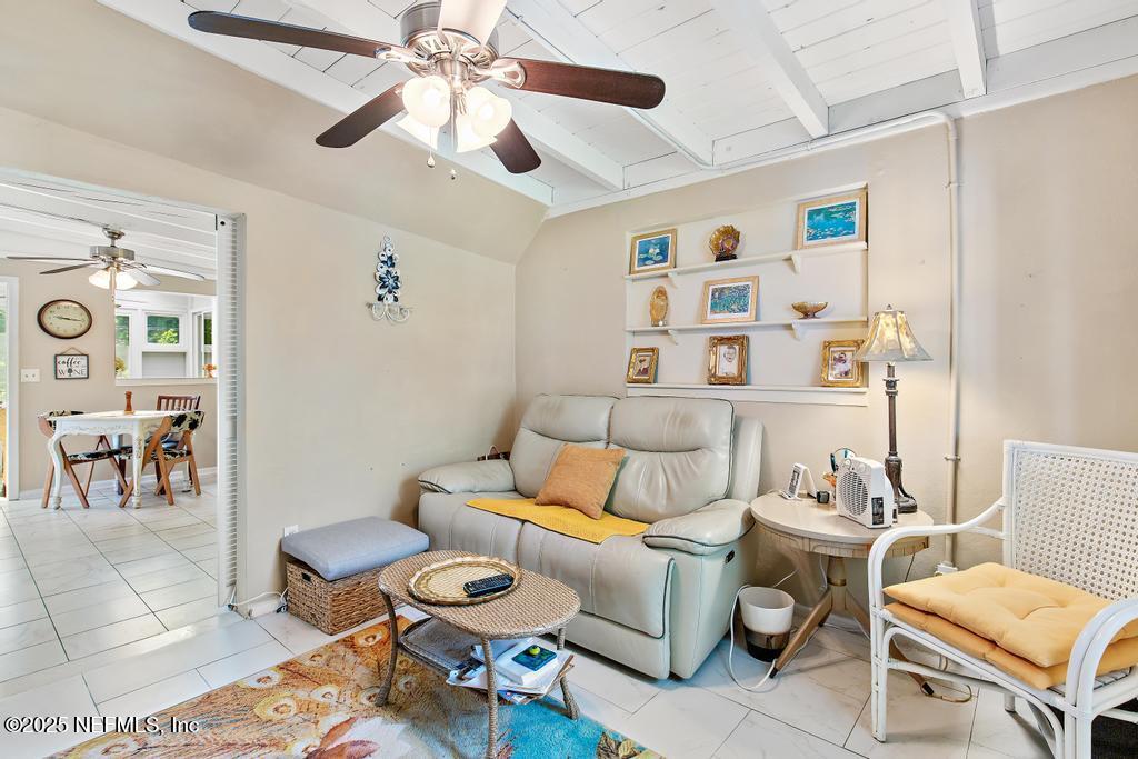 1810 Griflet Road Jacksonville, FL 32211 - Photo 24 of 42 a living room with furniture and a rug