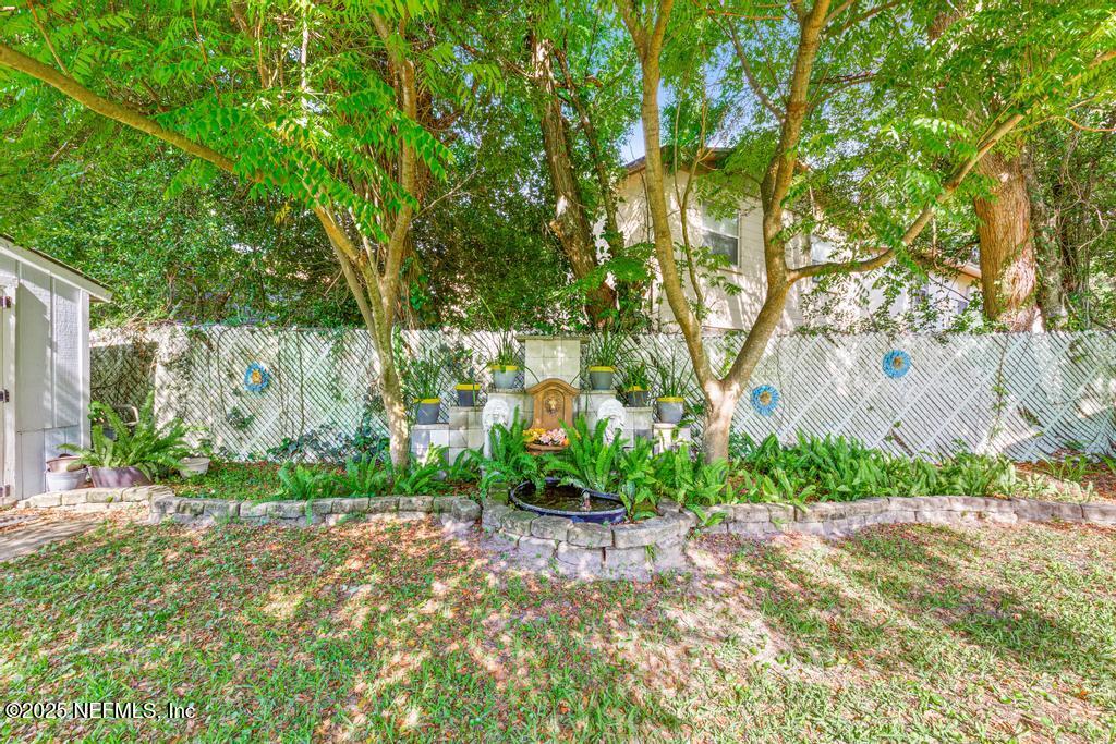 1810 Griflet Road Jacksonville, FL 32211 - Photo 28 of 42 a view of a yard with a tree