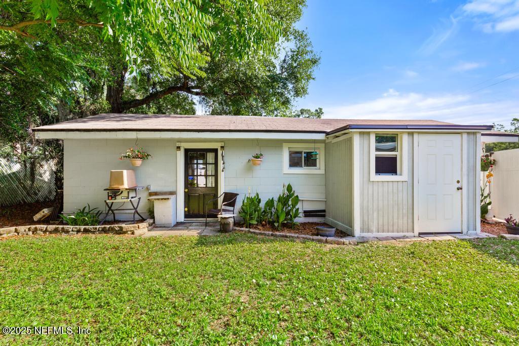 1810 Griflet Road Jacksonville, FL 32211 - Photo 29 of 42 a front view of a house with garden
