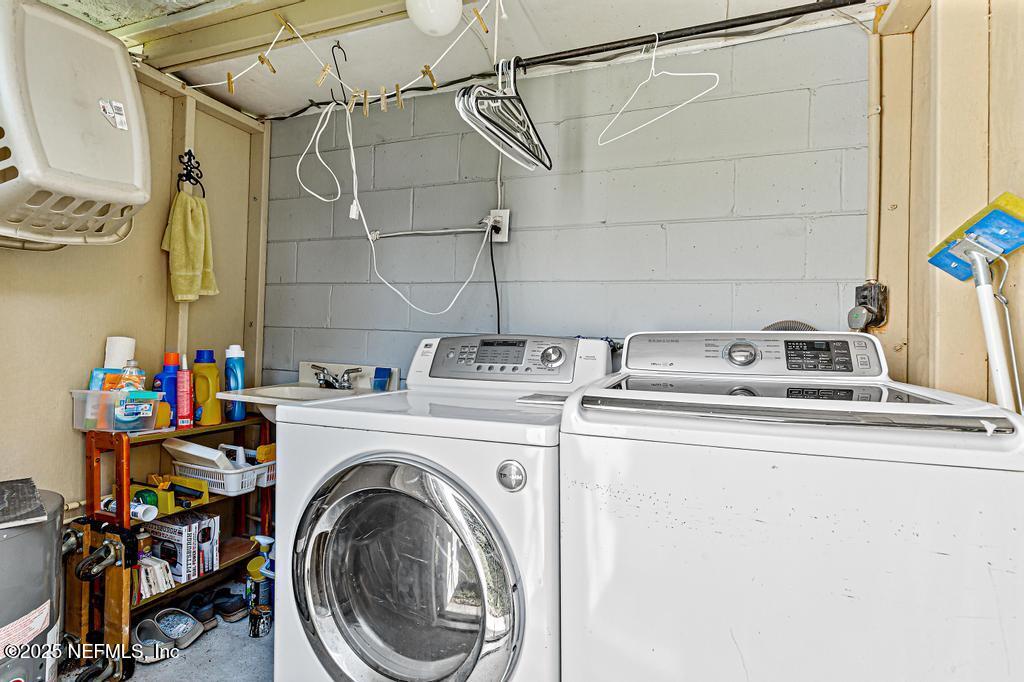 1810 Griflet Road Jacksonville, FL 32211 - Photo 30 of 42 a utility room with dryer and washer