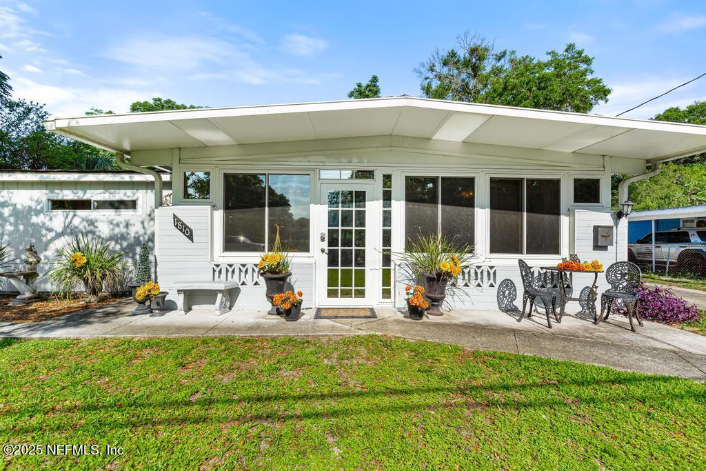 1810 Griflet Road Jacksonville, FL 32211 - Photo 3 of 42 a view of the front of house with outdoor seating