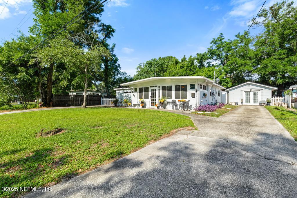 1810 Griflet Road Jacksonville, FL 32211 - Photo 4 of 42 a view of a house with a big yard