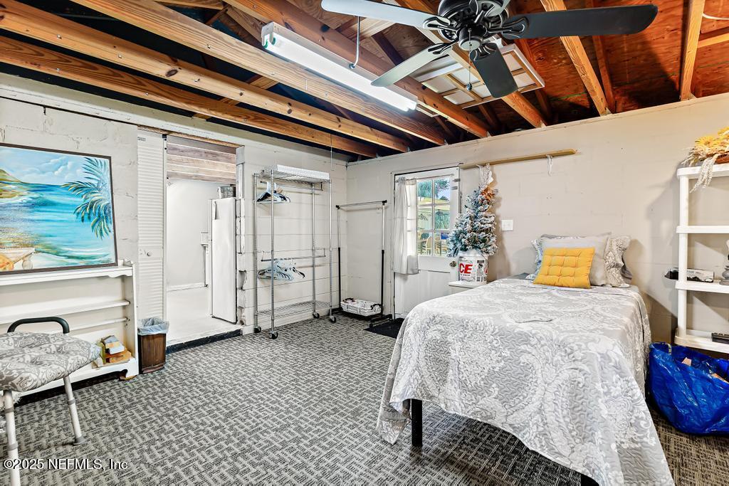 1810 Griflet Road Jacksonville, FL 32211 - Photo 41 of 42 a bedroom with a bed and a window