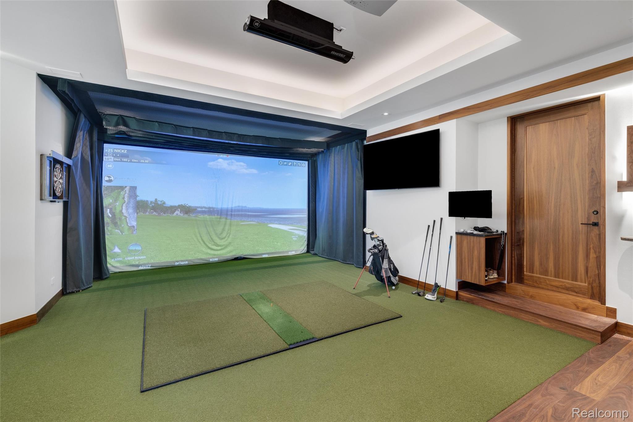 2700 Squirrel Road Bloomfield Hills, MI 48304 - Photo 63 of 83 Dedicated golf simulation room featuring a large projection screen, recessed lighting, and green synthetic turf flooring