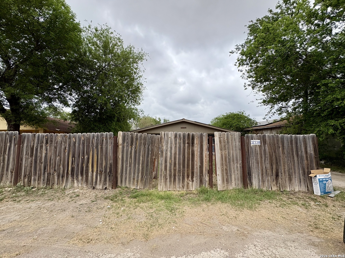 3233 Yucca Loop Eagle Pass, TX 78852 - Photo 11 of 11 a backyard of a house with wooden fence