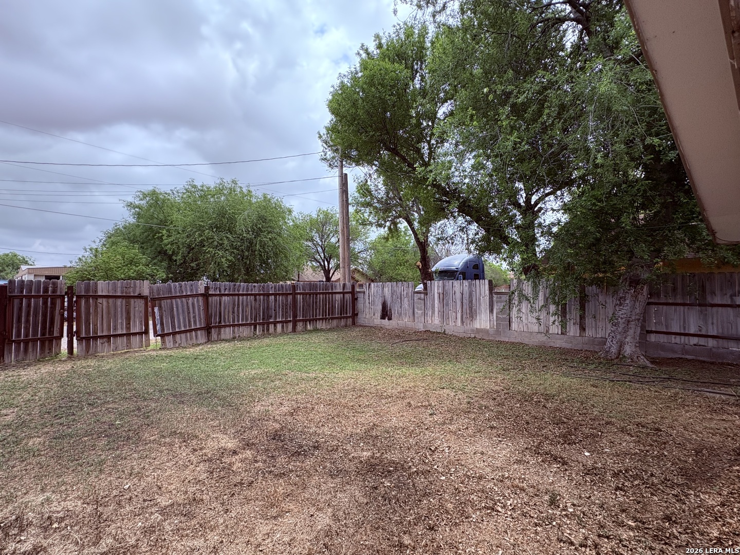3233 Yucca Loop Eagle Pass, TX 78852 - Photo 7 of 11 a view of a backyard with trees