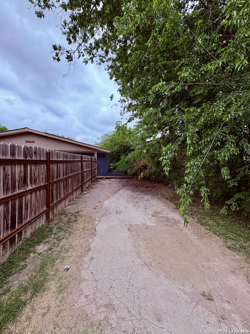 3233 Yucca Loop Eagle Pass, TX 78852 - Photo 8 of 11 a view of a backyard with wooden fence
