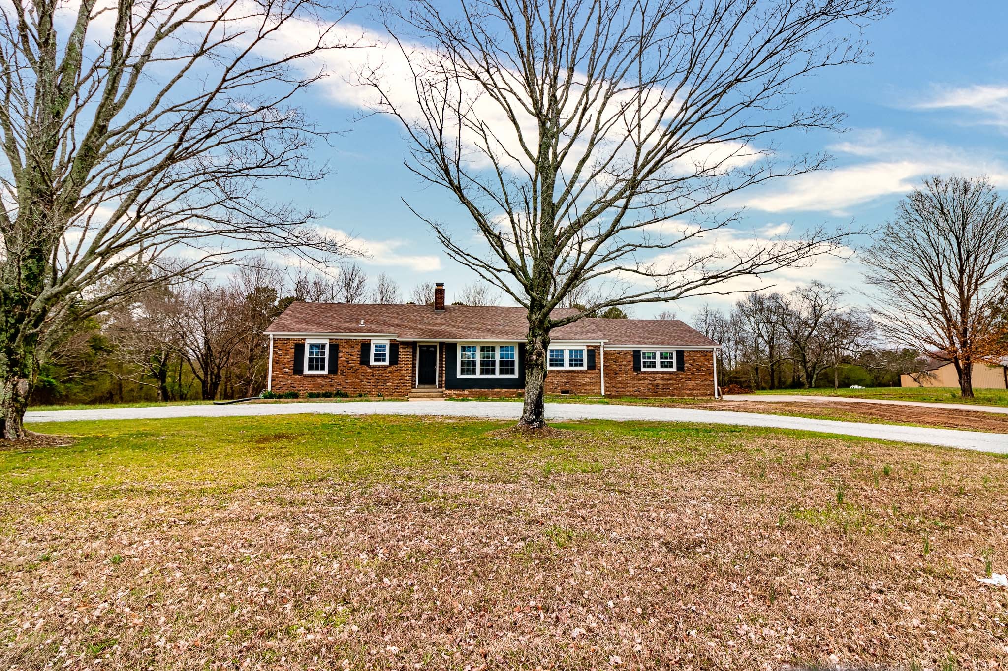 1031 Marable Road Lawrenceburg, TN 38464 - Photo 4 of 27 a big house with trees in front of it