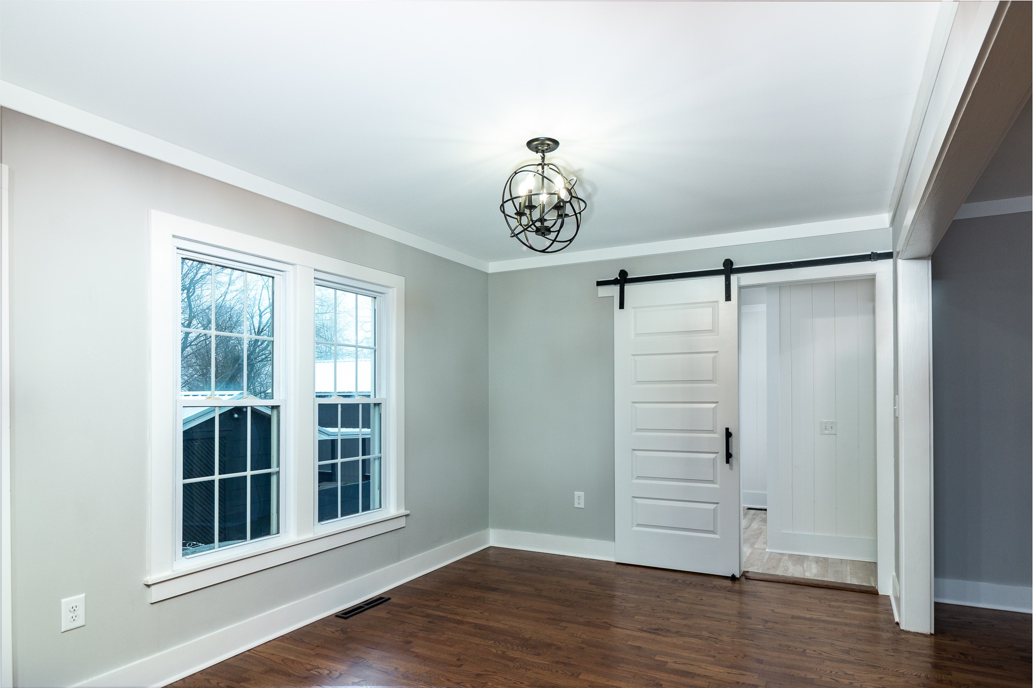 1031 Marable Road Lawrenceburg, TN 38464 - Photo 7 of 27 an empty room with wooden floor cabinet and windows