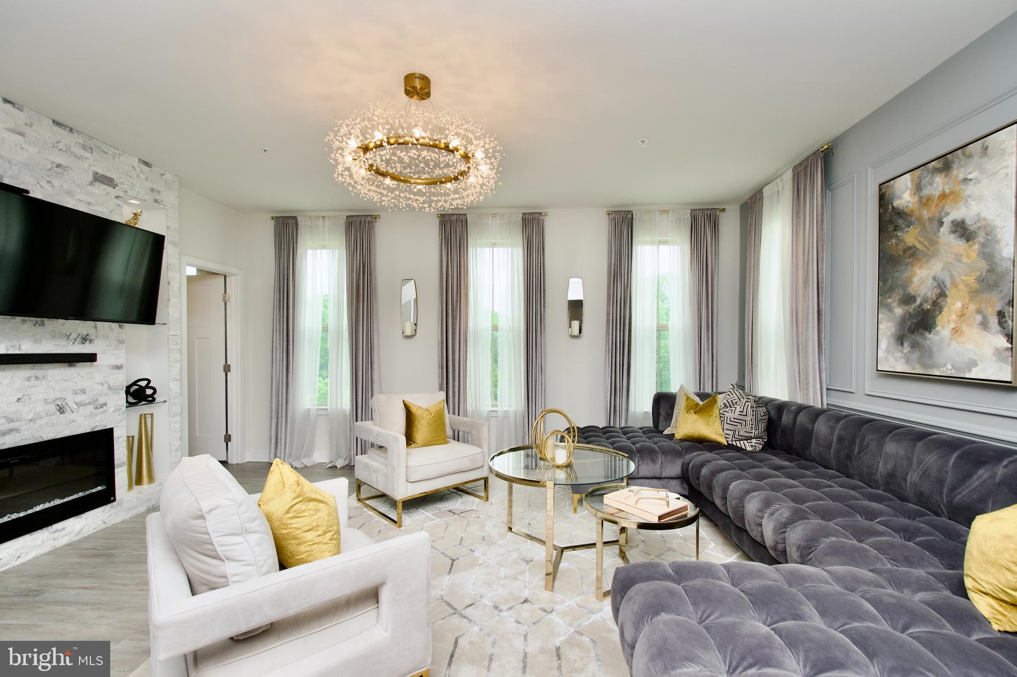 10810 Norbourne Farm Road Upper Marlboro, MD 20772 - Photo 2 of 38 a living room with furniture fireplace and flat screen tv