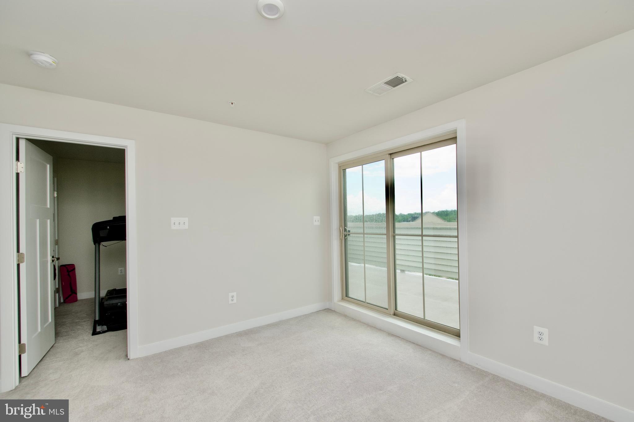 10810 Norbourne Farm Road Upper Marlboro, MD 20772 - Photo 28 of 38 an empty room with windows and closet