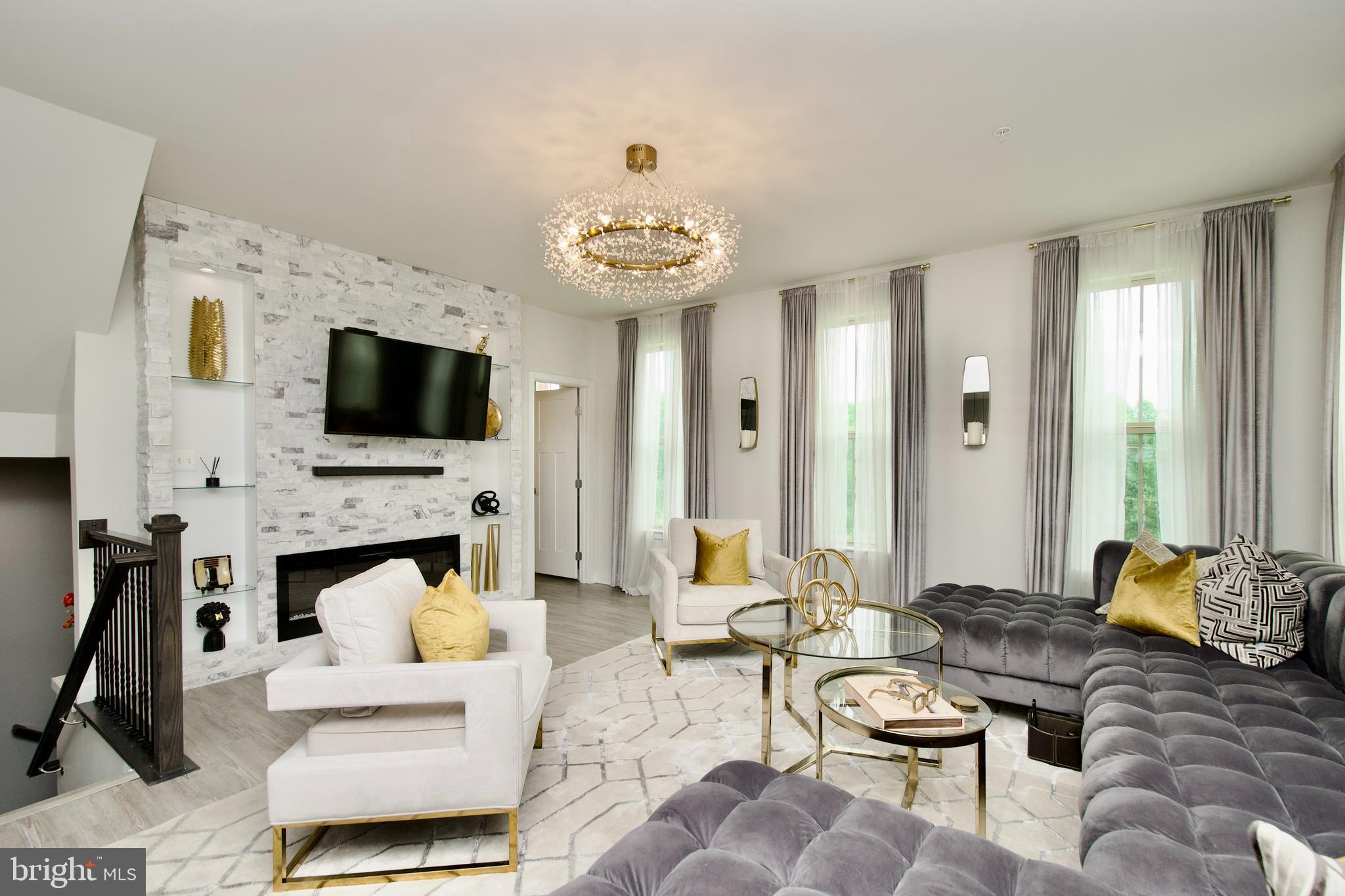 10810 Norbourne Farm Road Upper Marlboro, MD 20772 - Photo 3 of 38 a living room with furniture and a fireplace