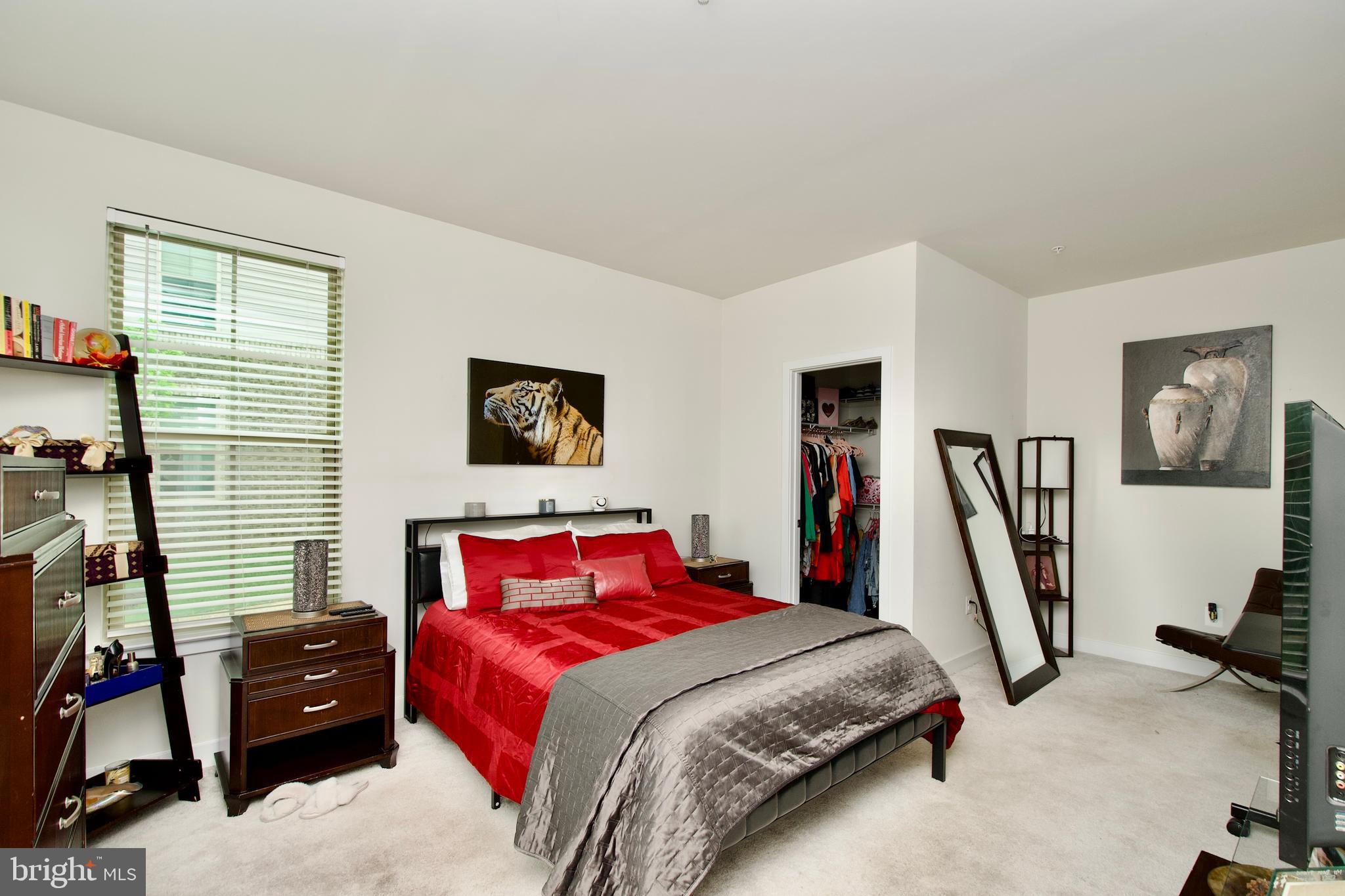 10810 Norbourne Farm Road Upper Marlboro, MD 20772 - Photo 34 of 38 a bedroom with a bed a couch and a window