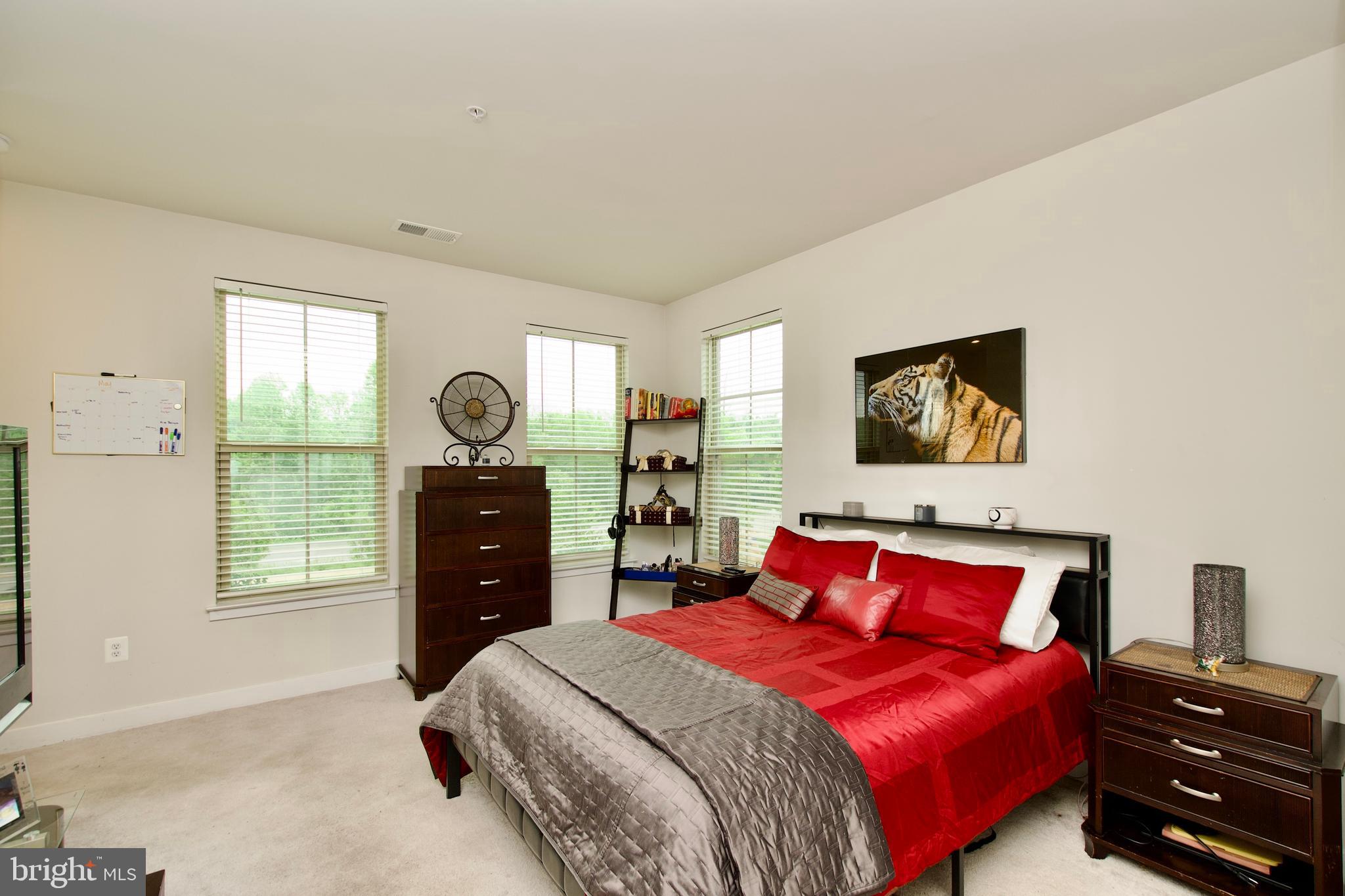 10810 Norbourne Farm Road Upper Marlboro, MD 20772 - Photo 35 of 38 a bedroom with a bed and a dresser