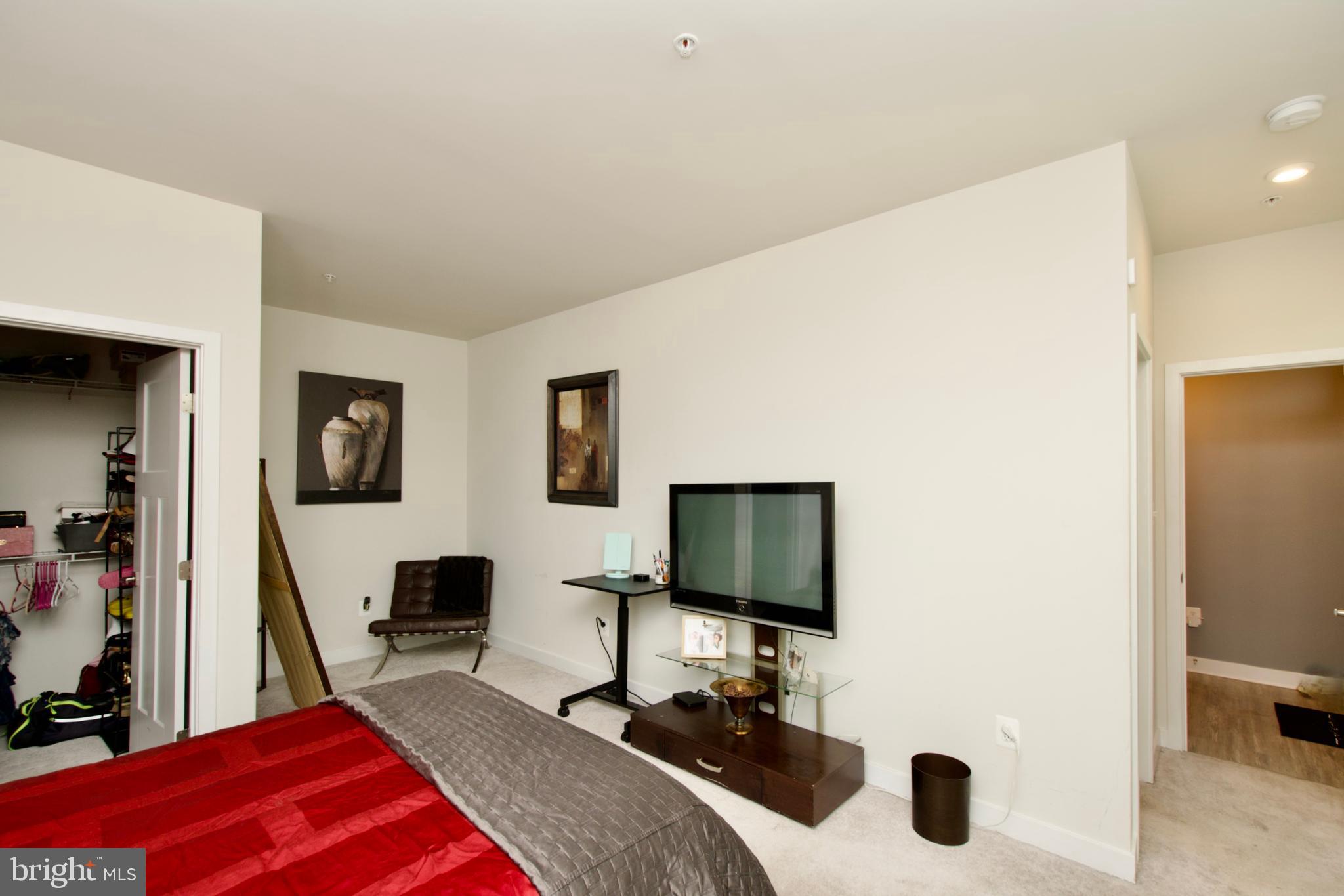 10810 Norbourne Farm Road Upper Marlboro, MD 20772 - Photo 36 of 38 a bedroom with a bed and a flat screen tv