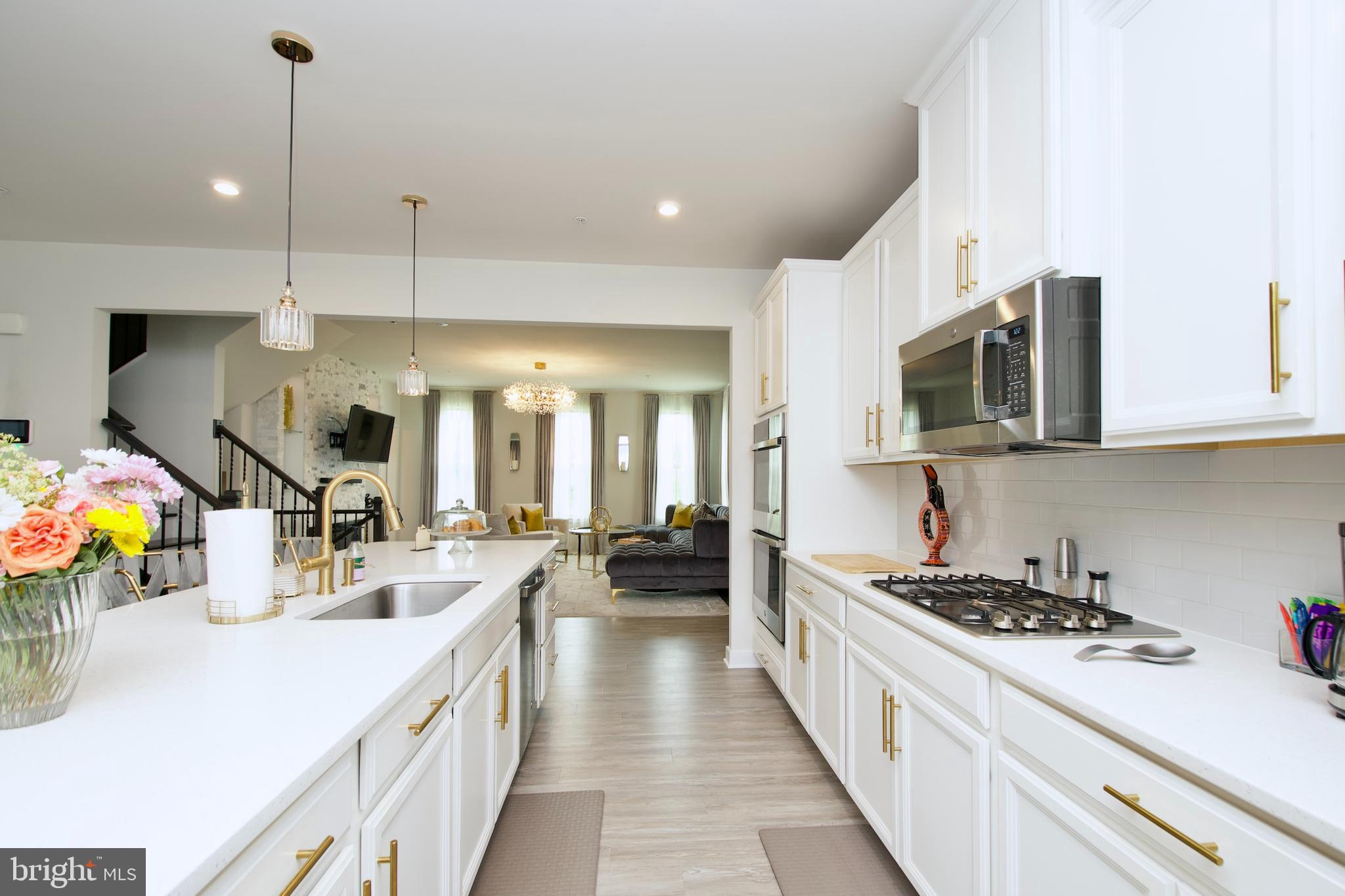 10810 Norbourne Farm Road Upper Marlboro, MD 20772 - Photo 10 of 38 a kitchen with stainless steel appliances a sink stove and cabinets