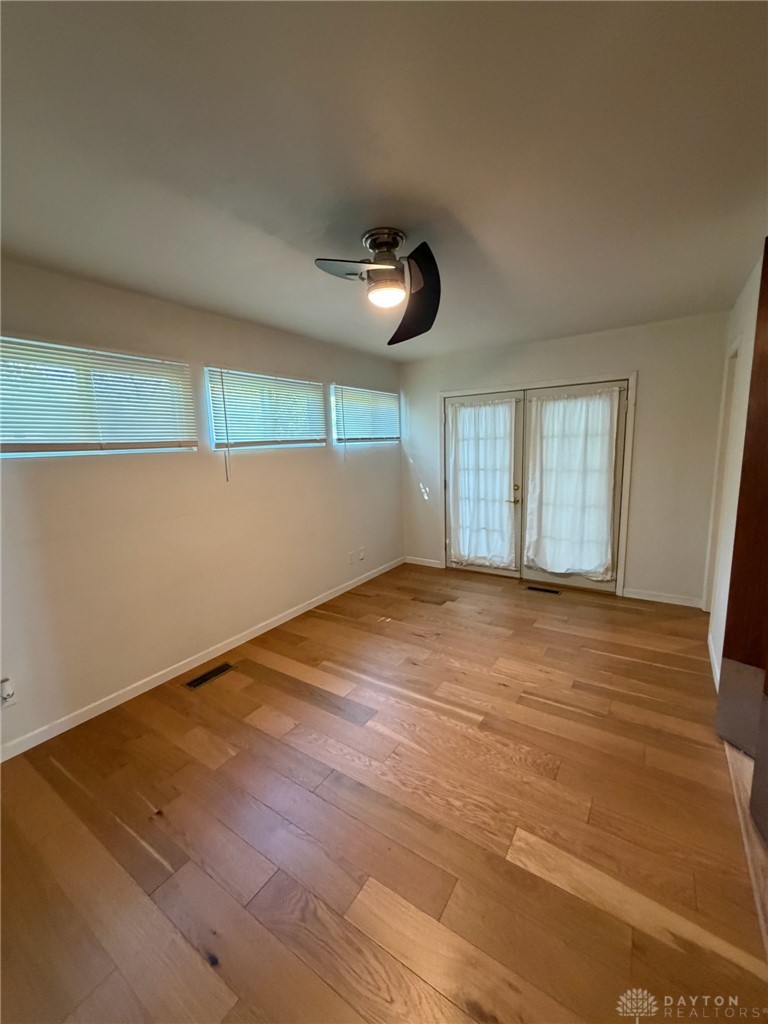 4924 Bayside Drive Riverside, OH 45431 - Photo 10 of 21 This bright room features beautiful hardwood floors and convenient outdoor access.