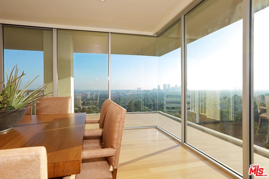 a view of a glass door with a floor to ceiling window