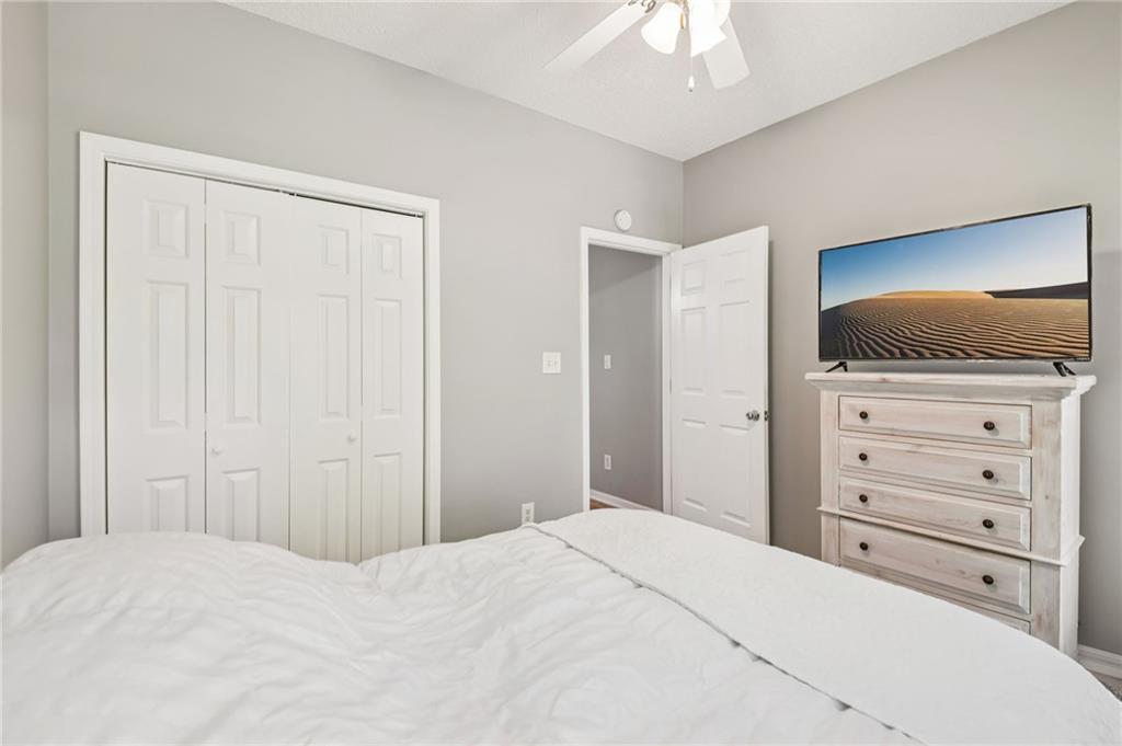 173 Freeman Forest Drive Newnan, GA 30265 - Photo 11 of 35 a bedroom with a bed and a flat screen tv