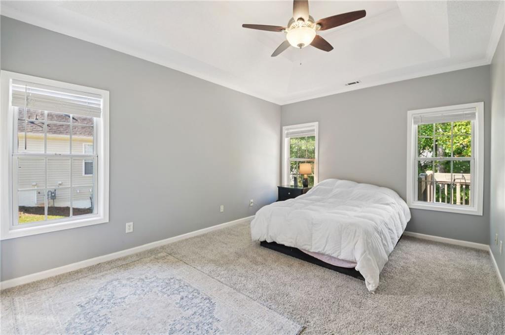 173 Freeman Forest Drive Newnan, GA 30265 - Photo 13 of 35 a bedroom with a bed and window