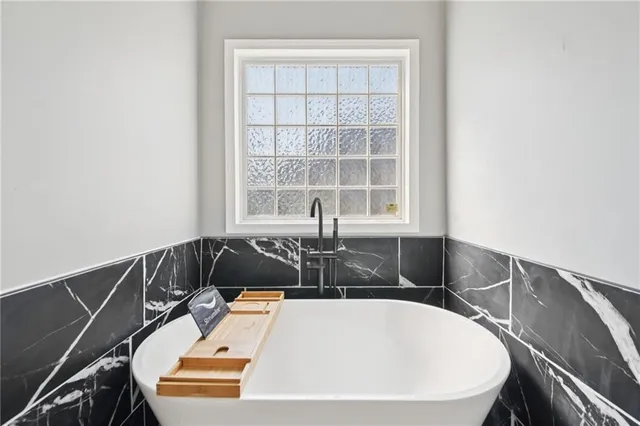 a bathroom with a sink and bathtub