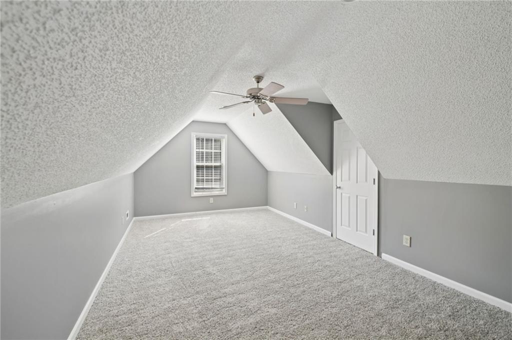 173 Freeman Forest Drive Newnan, GA 30265 - Photo 18 of 35 a view of a big room with closet and ceiling fan