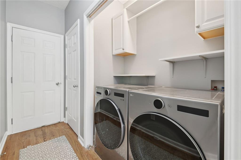 173 Freeman Forest Drive Newnan, GA 30265 - Photo 20 of 35 a utility room with dryer and washer