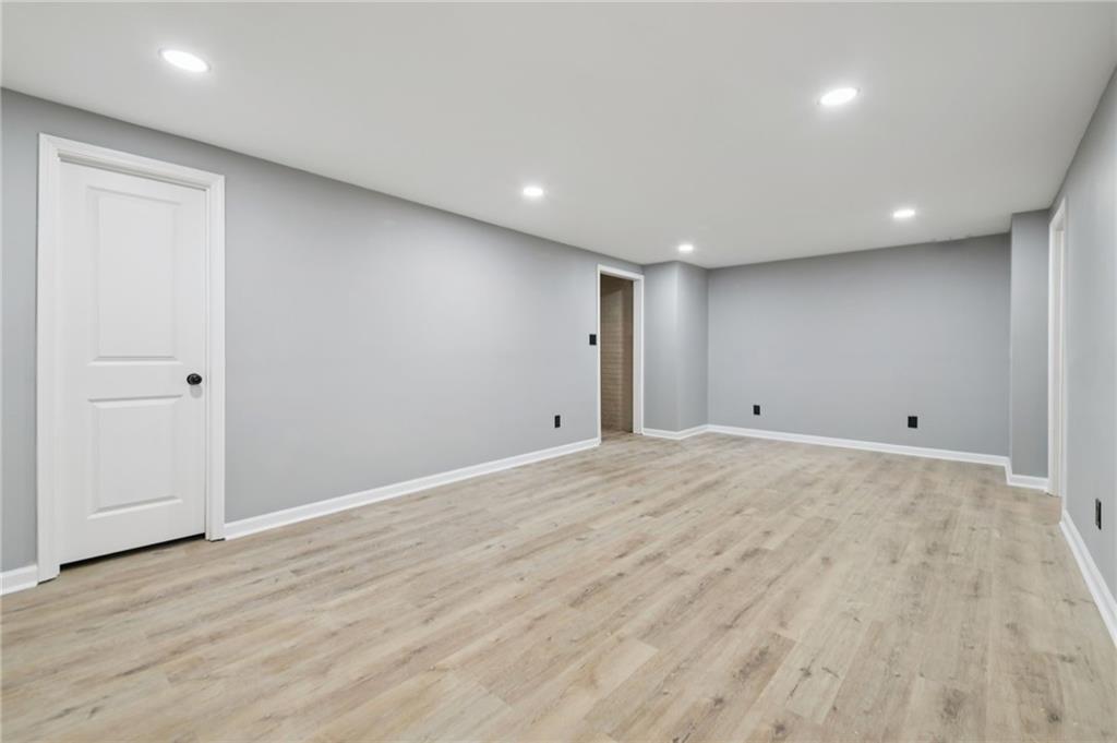 173 Freeman Forest Drive Newnan, GA 30265 - Photo 22 of 35 an empty room with wooden floor