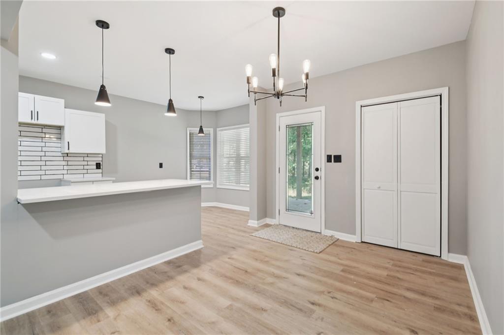 173 Freeman Forest Drive Newnan, GA 30265 - Photo 27 of 35 a view of an empty room and kitchen view