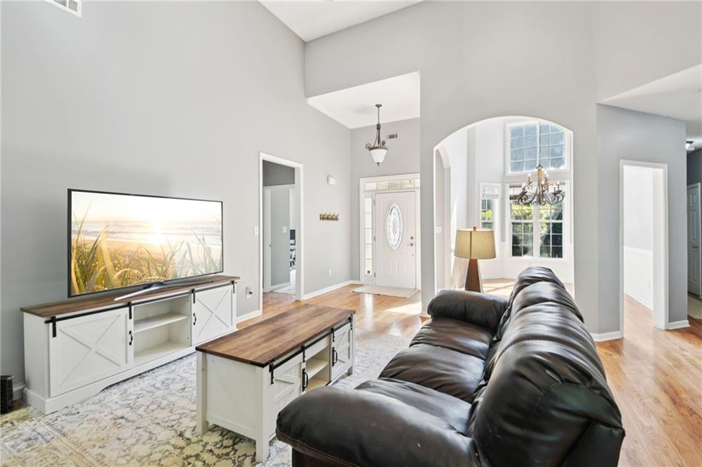 173 Freeman Forest Drive Newnan, GA 30265 - Photo 3 of 35 a living room with furniture and a flat screen tv