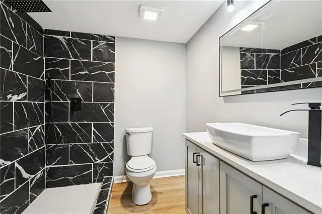 a view of a backyard with floor to ceiling window and yard