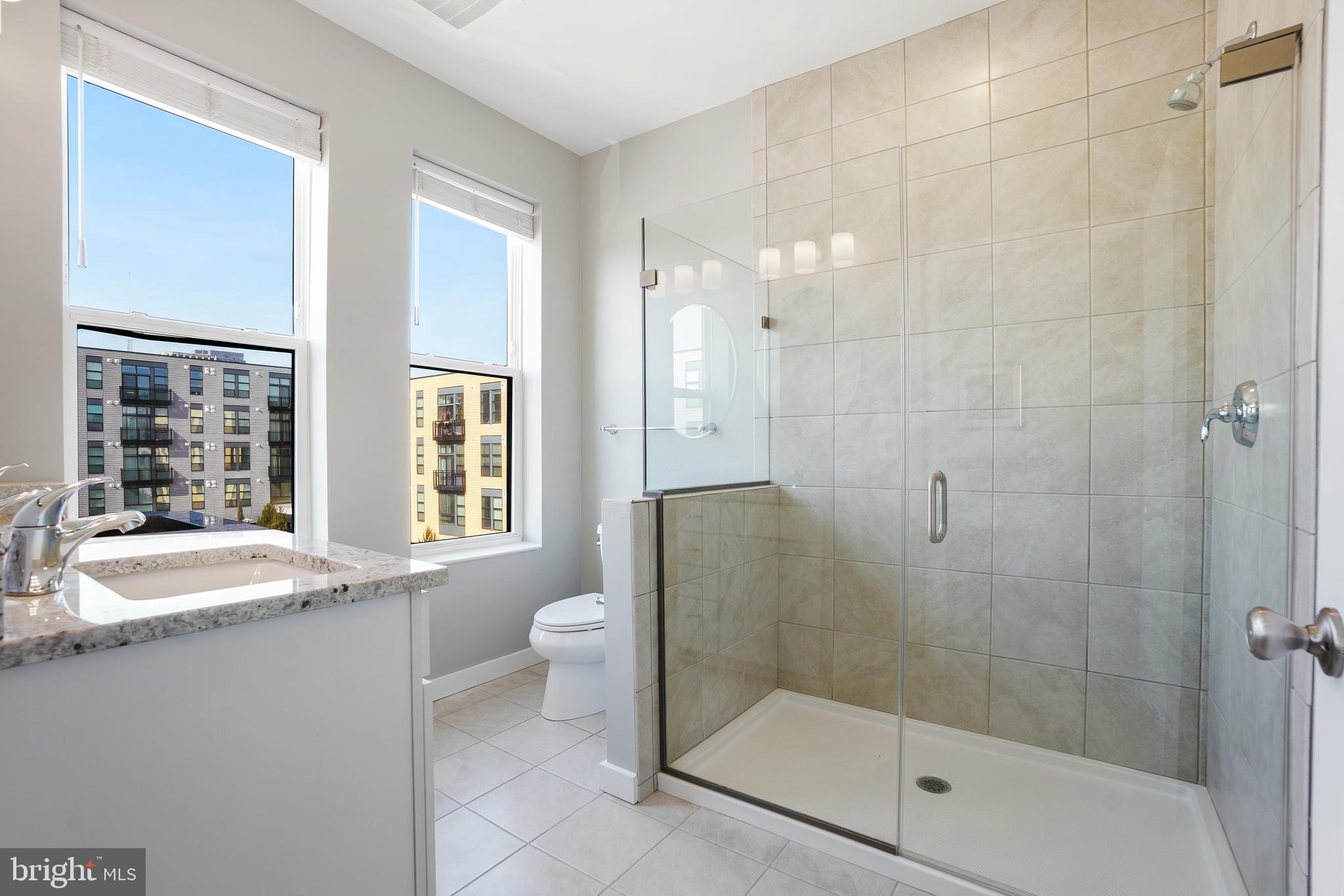 8012 Grove Street Silver Spring, MD 20910 - Photo 20 of 38 Primary Bathroom with a Glass Enclosed Shower