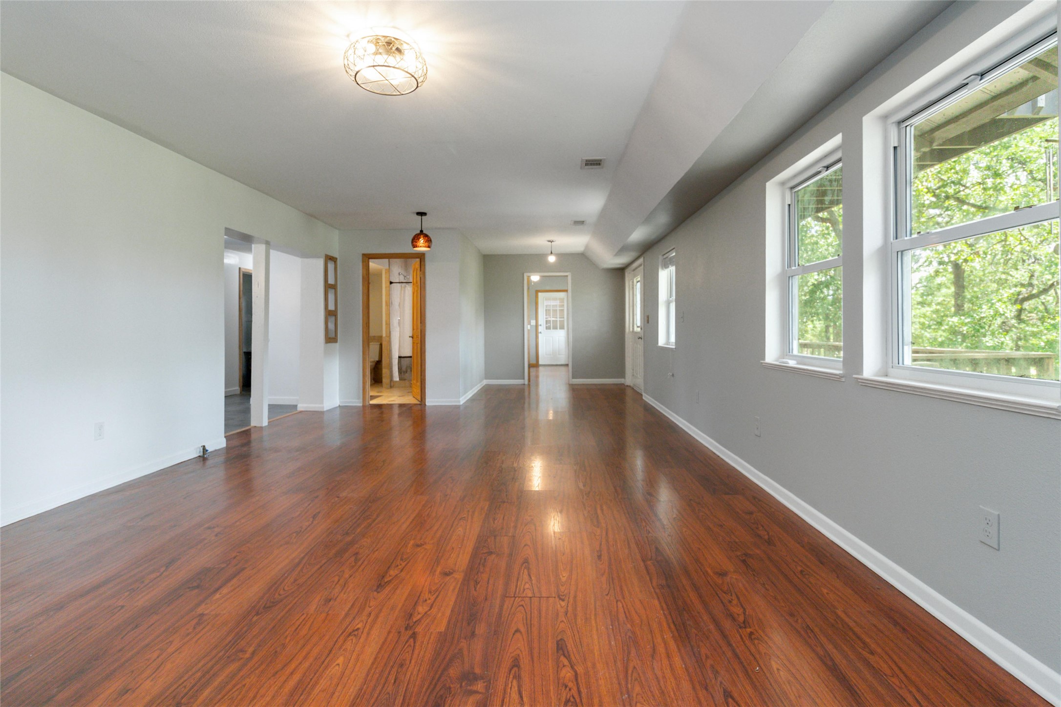 180 Ironstone Road Smithville, TX 78957 - Photo 5 of 37 Spare room with dark wood finished floors and baseboards