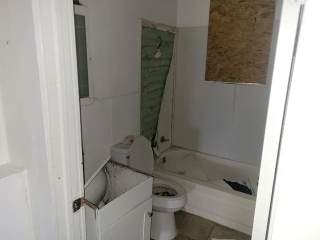 a room with a sink and cabinets