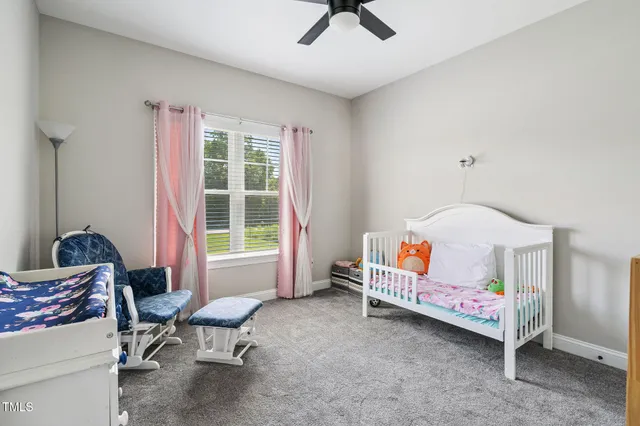 a bedroom with furniture and windows