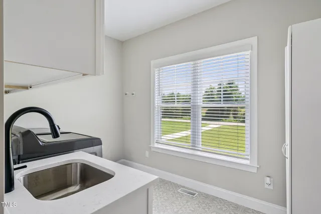 a close view of a sink and a microwave