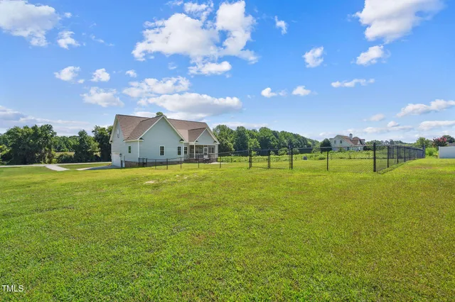 a view of a house with a big yard