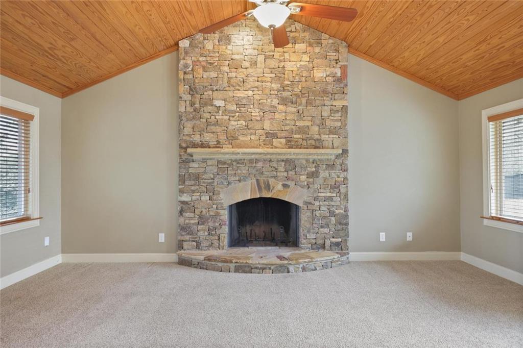 3851 Trickum Road Marietta, GA 30066 - Photo 14 of 27 a view of an empty room with a fireplace and a window