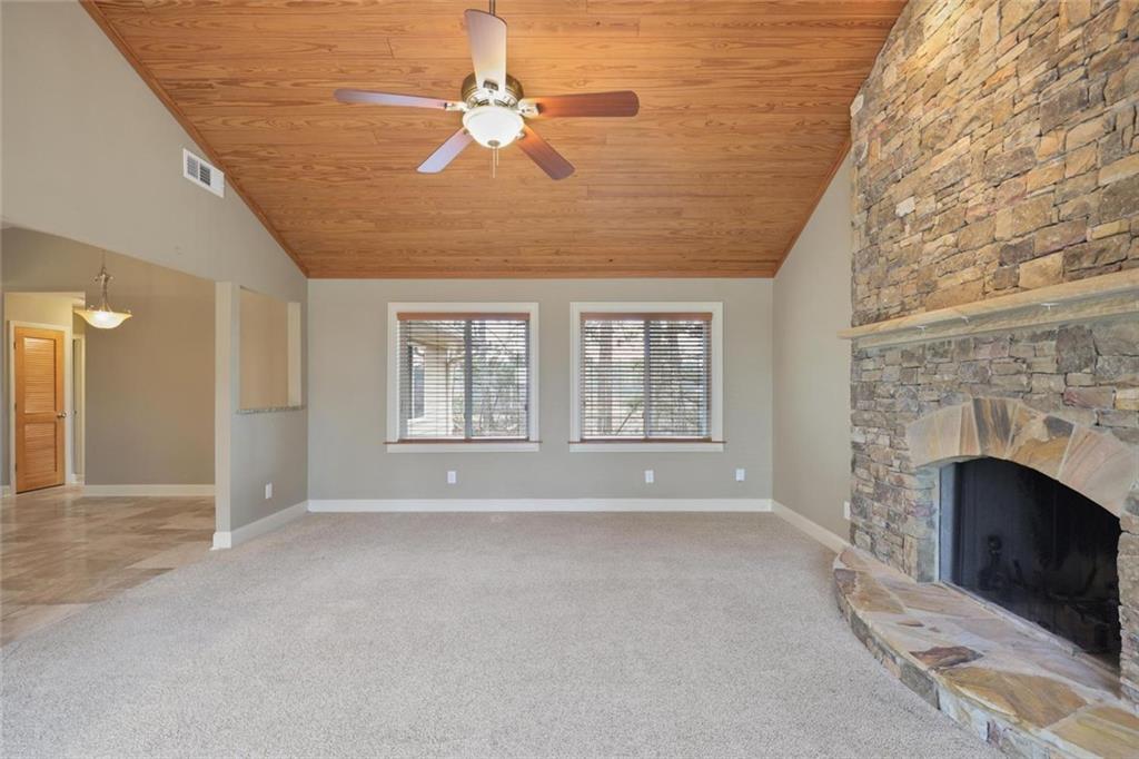 3851 Trickum Road Marietta, GA 30066 - Photo 15 of 27 a view of an empty room with a fireplace and a window