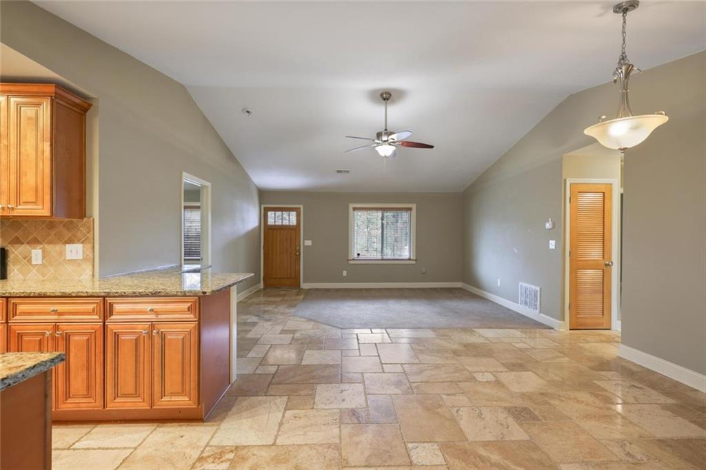 3851 Trickum Road Marietta, GA 30066 - Photo 16 of 27 a view of a bathroom with a sink and a chandelier